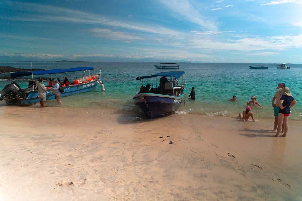 Tourists and local residents enjoy a day at the beach in the pristine shores of the Chiriqui Gulf, currently threatened by the Puerto Baru project.